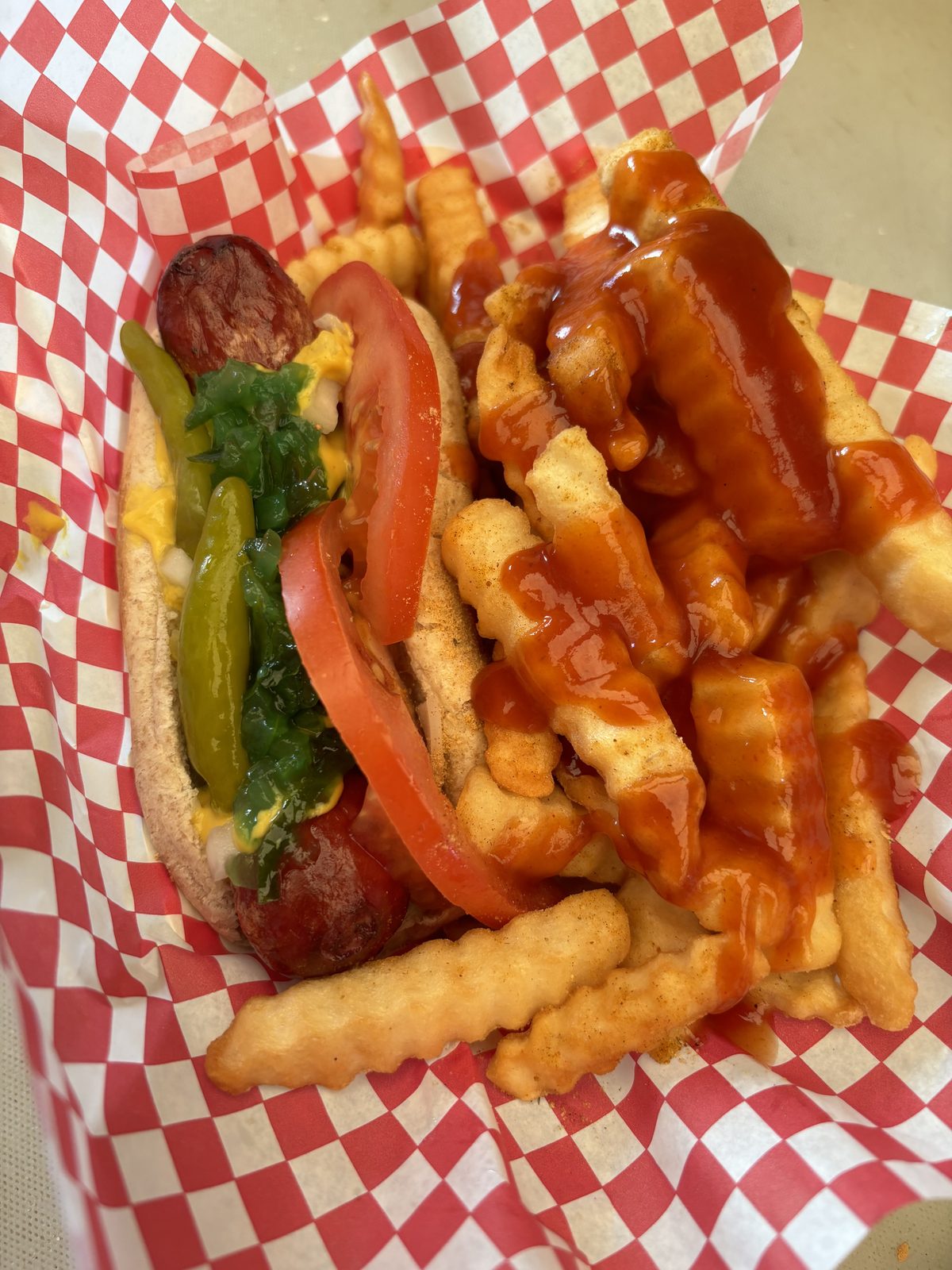 Dragged-through-the-garden dog with seasoned crinkle fries