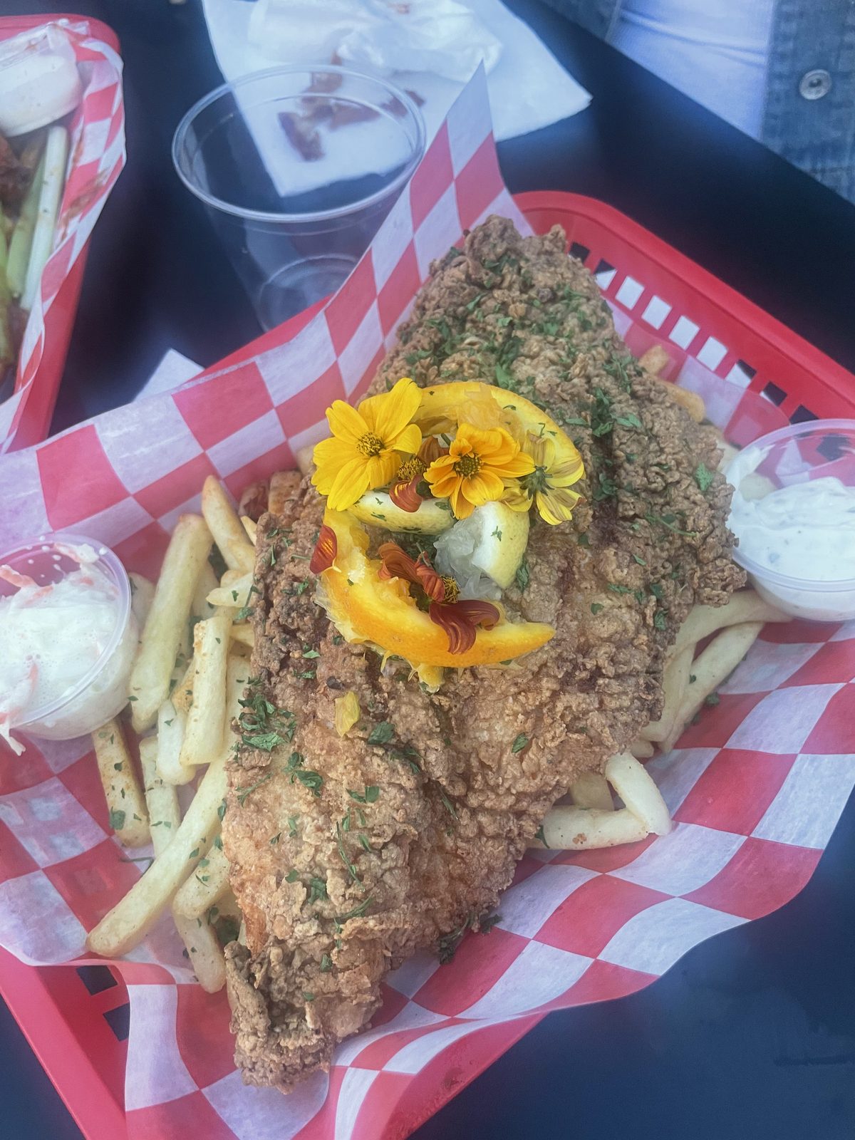 Fried fish basket over fries with slaw and tartar sauce