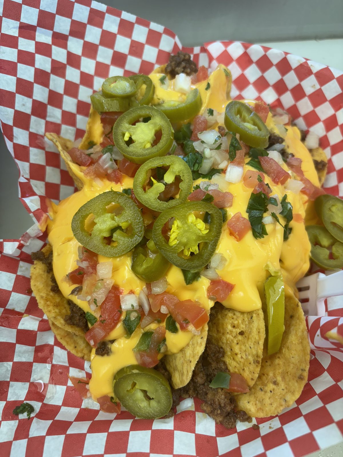 Loaded nachos with queso, beef, pico and jalapenos