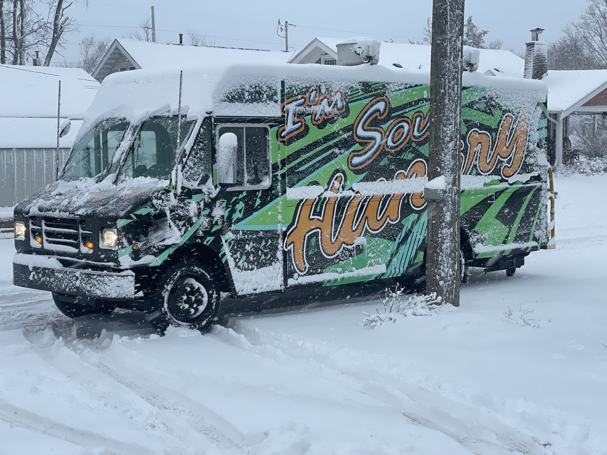 The I'm Soul Hungry truck parked in deep Iowa snow